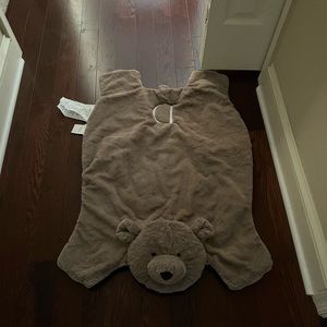 Pottery barn bear rug embroidered with a “D”